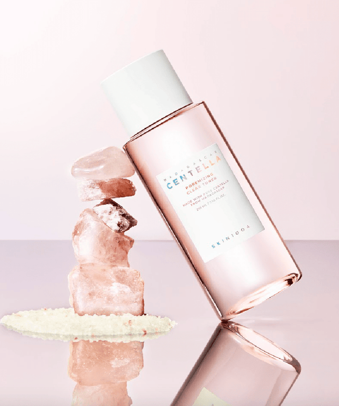 SKIN1004 Madagascar Centella Poremizing Clear Toner 210ml bottle with natural elements on pastel background