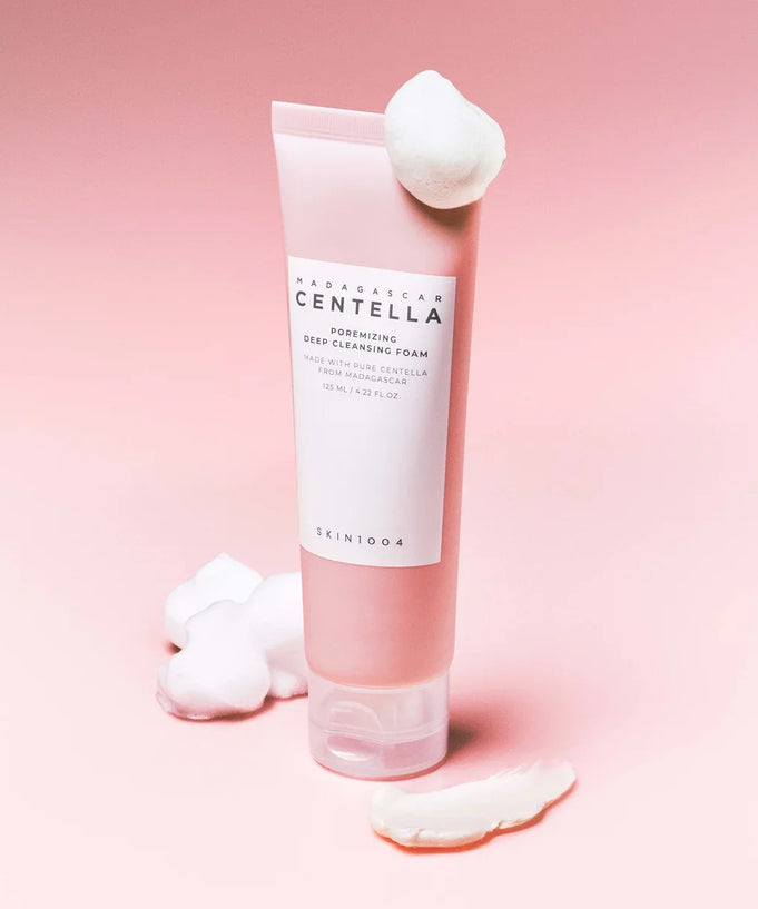 SKIN1004 Madagascar Centella Poremizing Deep Cleansing Foam 125ml on pink background with foam accents.