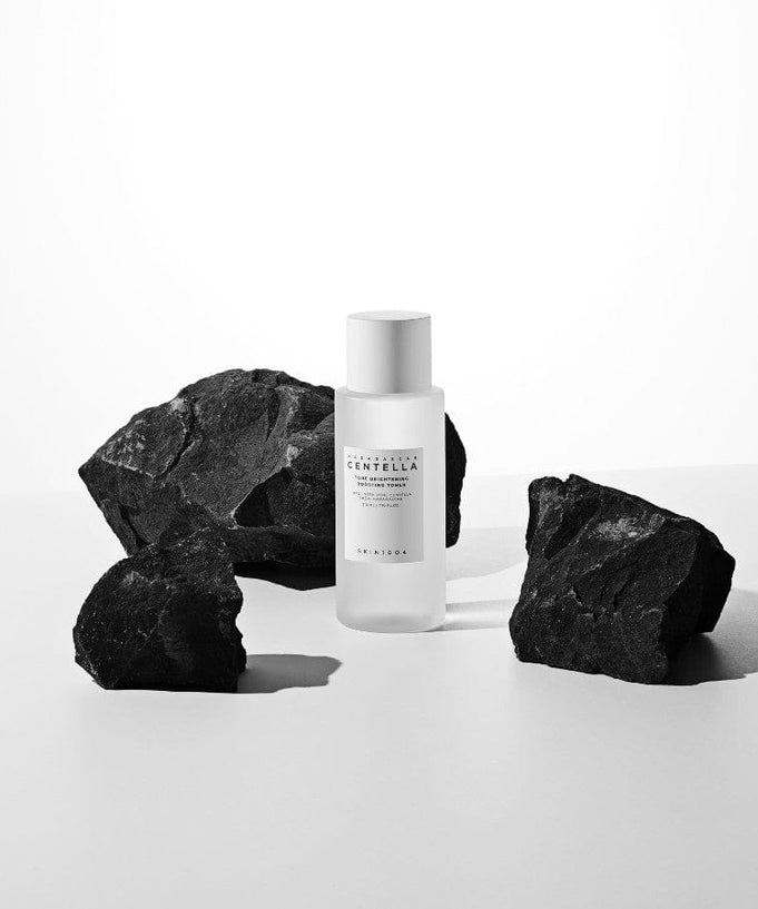 SKIN1004 Madagascar Centella Tone Brightening Boosting Toner 210ml bottle on display with rocks