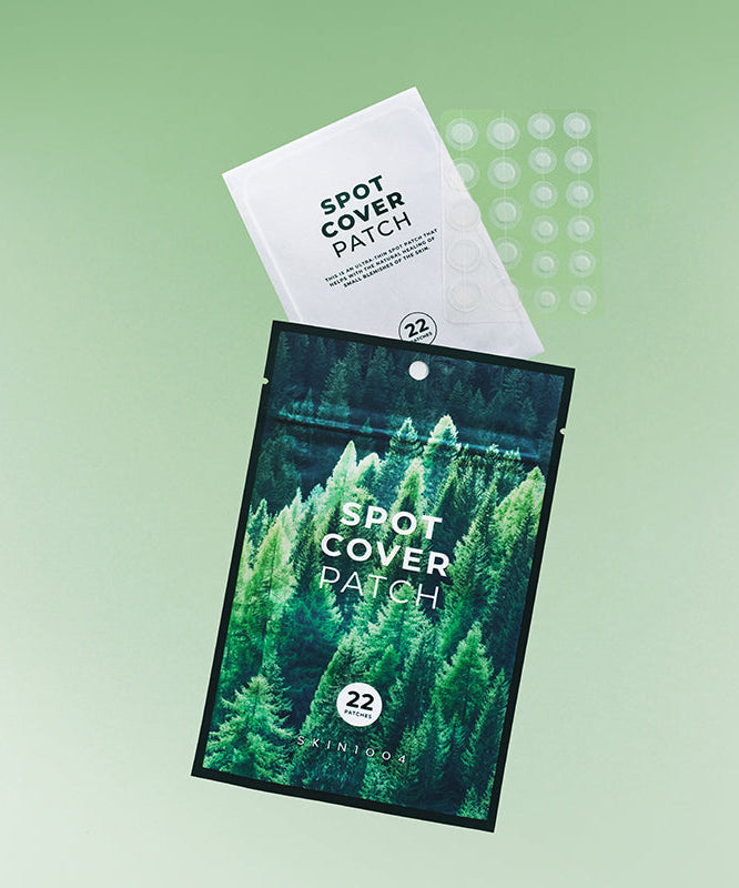 SKIN1004 Spot Cover Patch 22patch with packaging and individual patches displayed on green background