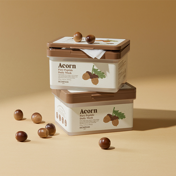 SKINFOOD Acorn Pore Peptide Daily Mask 30p 270g product packaging with acorns displayed on a beige background.