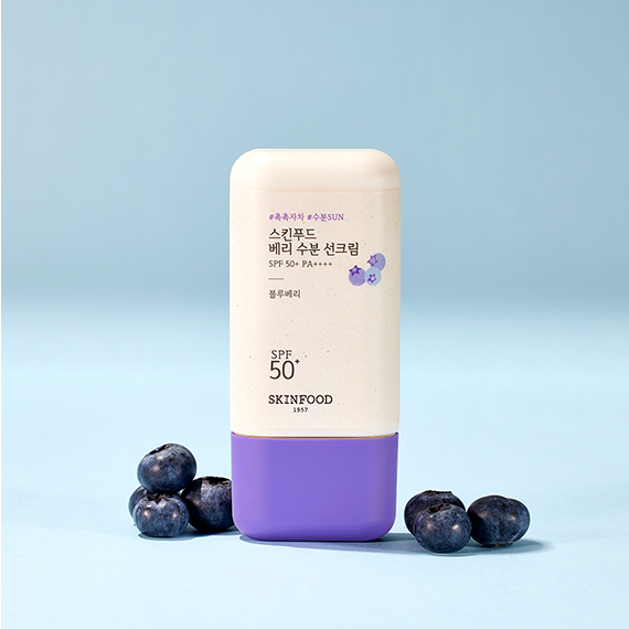 SKINFOOD Berry Moisturizing Sun Cream 50ml with blueberries on a light blue background