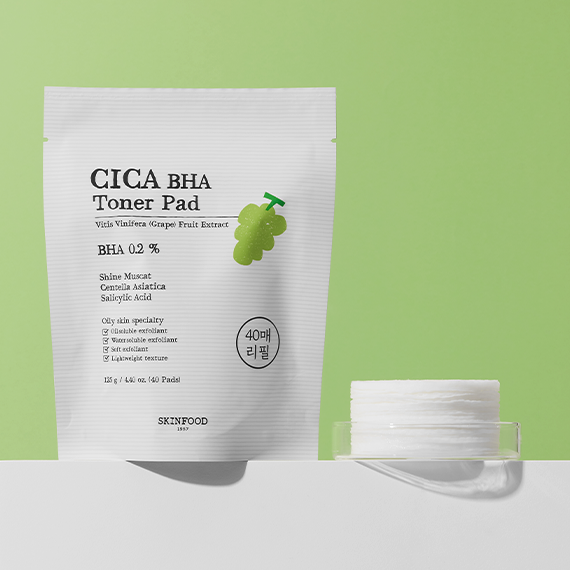 SKINFOOD CICA BHA Toner Pad package and product display on a green and white background.