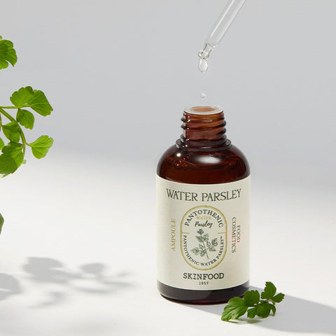Bottle of SKINFOOD Pantothenic Water Parsley Ampoule 50ml with dropper and parsley leaves