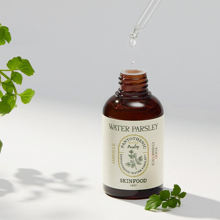 Bottle of SKINFOOD Pantothenic Water Parsley Ampoule 50ml with dropper and parsley leaves