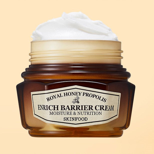 SKINFOOD Royal Honey Propolis Enrich Barrier Cream 63ml in an open jar showcasing rich, creamy texture against a soft background.