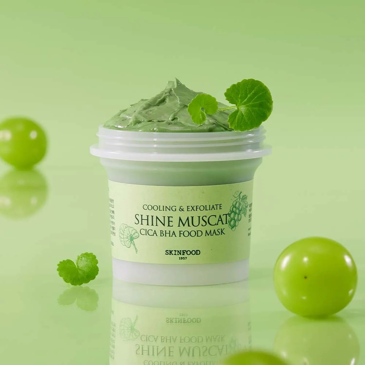 SKINFOOD Shine Muscat Cica Baja Food Mask 120g jar with green texture and grapes on a green background.