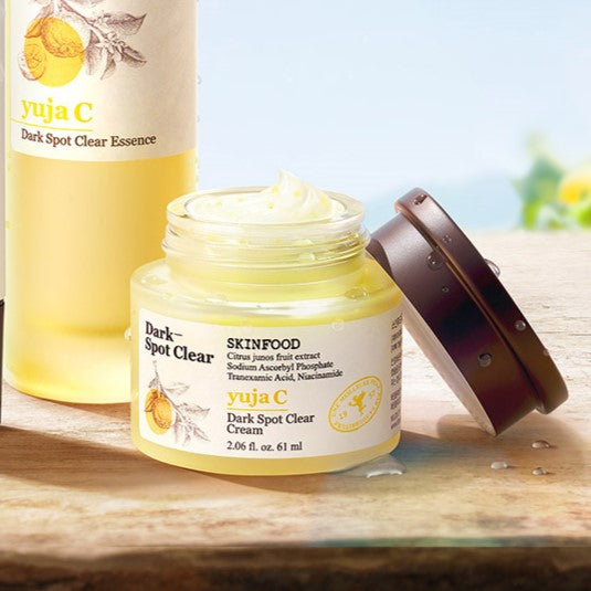SKINFOOD Yuja C Dark Spot Clear Cream 61ml jar with lid open showcasing product texture, for treating dark spots and skin brightening.