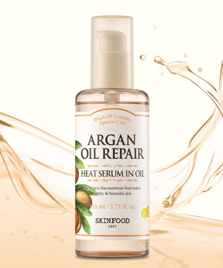SKINFOOD Argan Oil Repair Heat Serum In Oil 110ml bottle against oil splash background