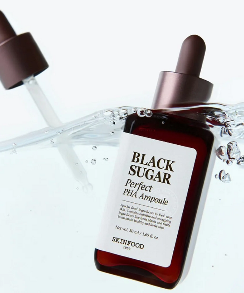 SKINFOOD Black Sugar Perfect PHA Ampoule 50ml submerged in water with dropper lid, highlighting skincare product packaging and design.
