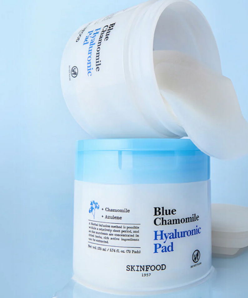 Open container of SKINFOOD Blue Chamomile Hyaluronic Gel Pads 70 Sheets with pads visible, enhancing skincare routine.