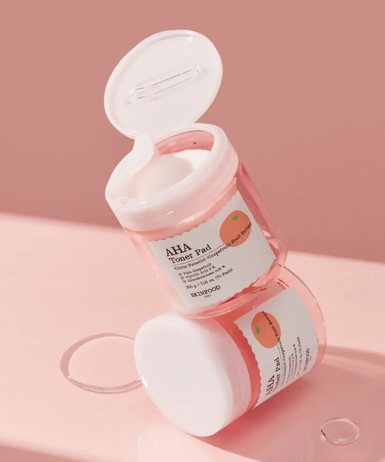 SKINFOOD Pink Grapefruit AHA Toner Pad 70 sheets on pink background