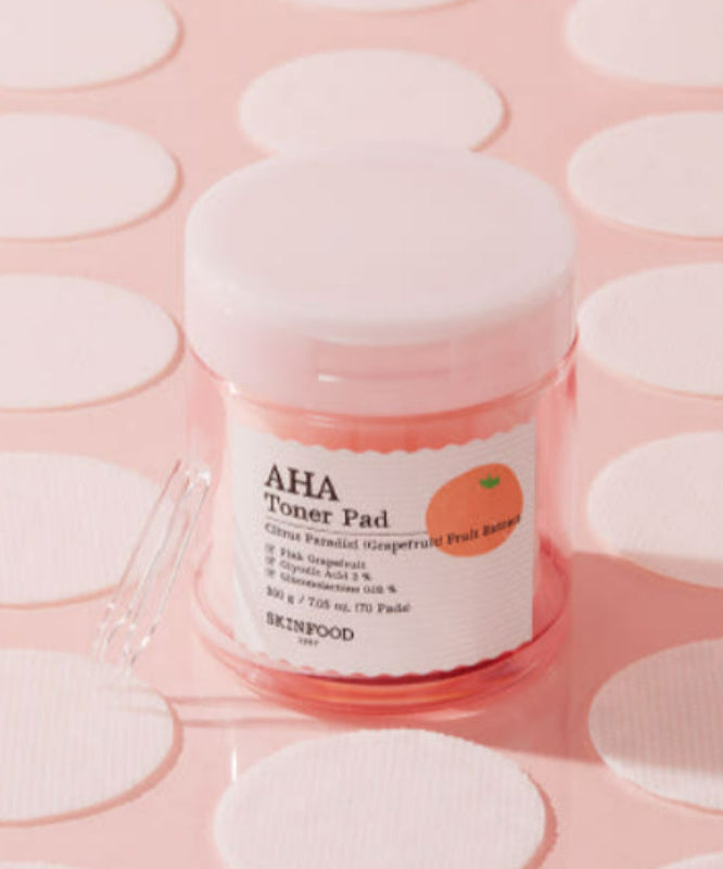 SKINFOOD Pink Grapefruit AHA Toner Pad 70 sheets on pink background
