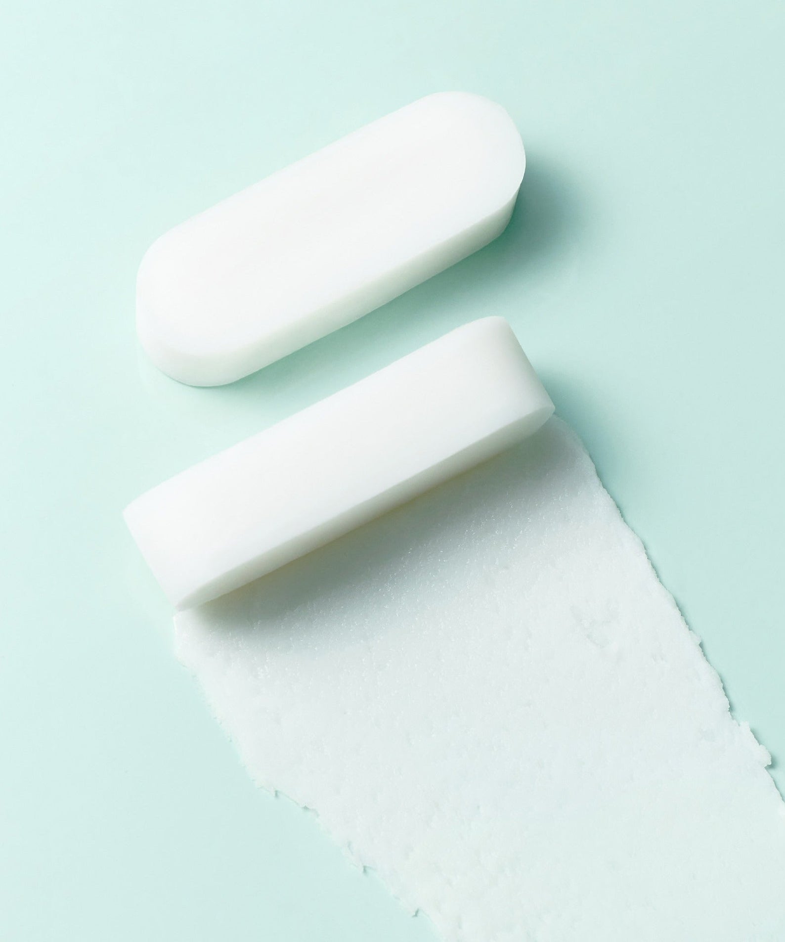 White solid bar with texture on a light green background