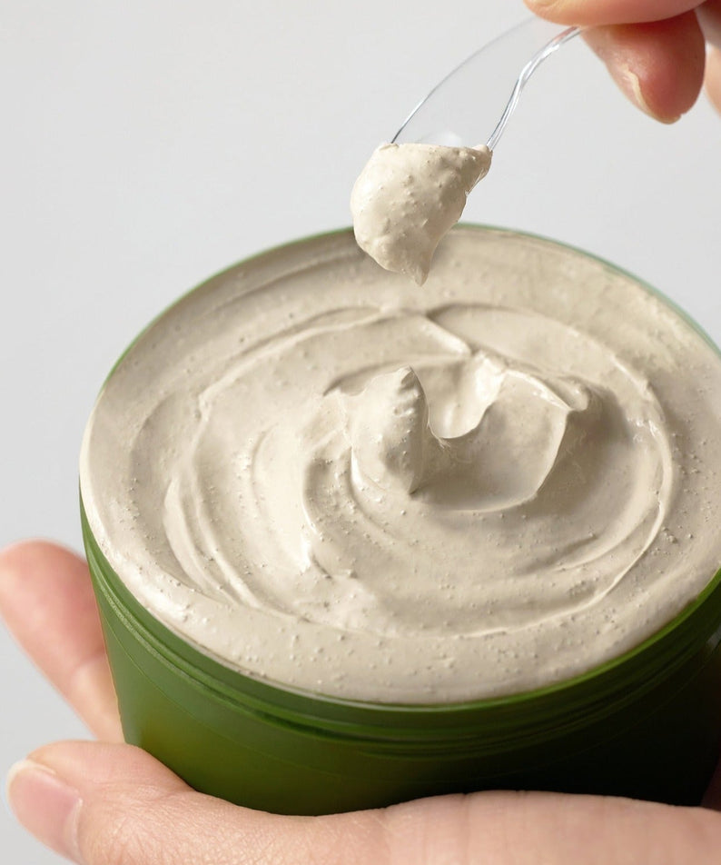SOME BY MI Super Matcha Pore Clean Clay Mask 100g in jar with a dollop on spatula, showcasing creamy texture for pore care.