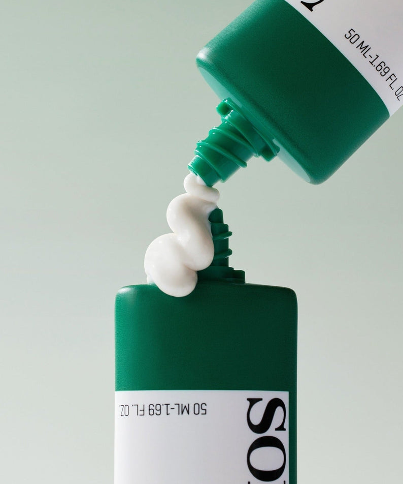 SOME BY MI Truecica Aqua Calming Sun Cream 50ml being poured from green tube for skincare protection