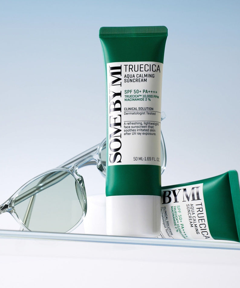 SOME BY MI Truecica Aqua Calming Sun Cream 50ml with sunglasses, SPF 50+, soothing skincare product for sun protection.
