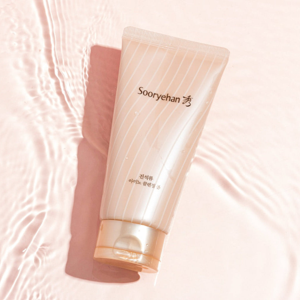 SOORYEHAN Jinseokryu Amino Cleansing Foam 160ml tube on a pink background illustrating skincare product packaging