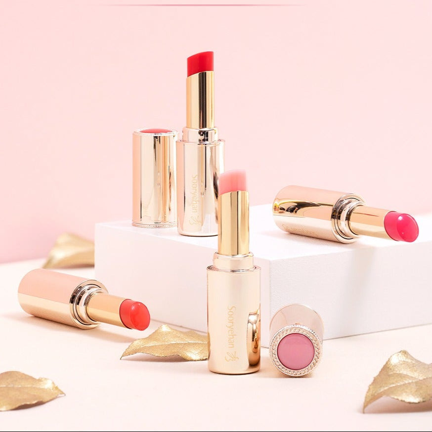 SOORYEHAN Yeon Silk Lip Balm 3.5g displayed elegantly with gold accents on a pink backdrop