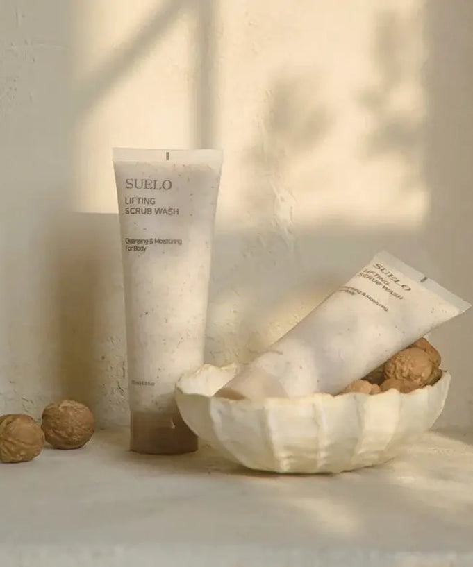 SUELO Lifting Body Scrub Wash in elegant packaging with natural elements, ideal for skin revitalization and moisturizing.