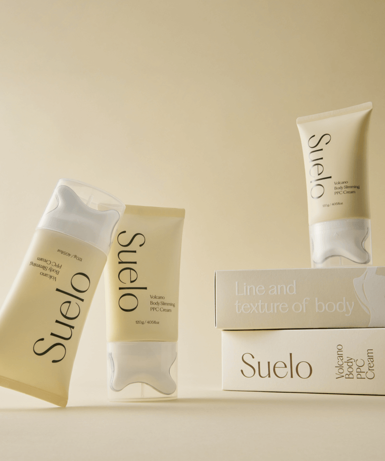 SUELO Volcano Body PPC Cream tubes and boxes on a beige background showcasing the product.