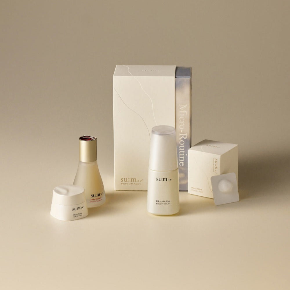 SU:M37 Micro routine set featuring skincare products on beige background