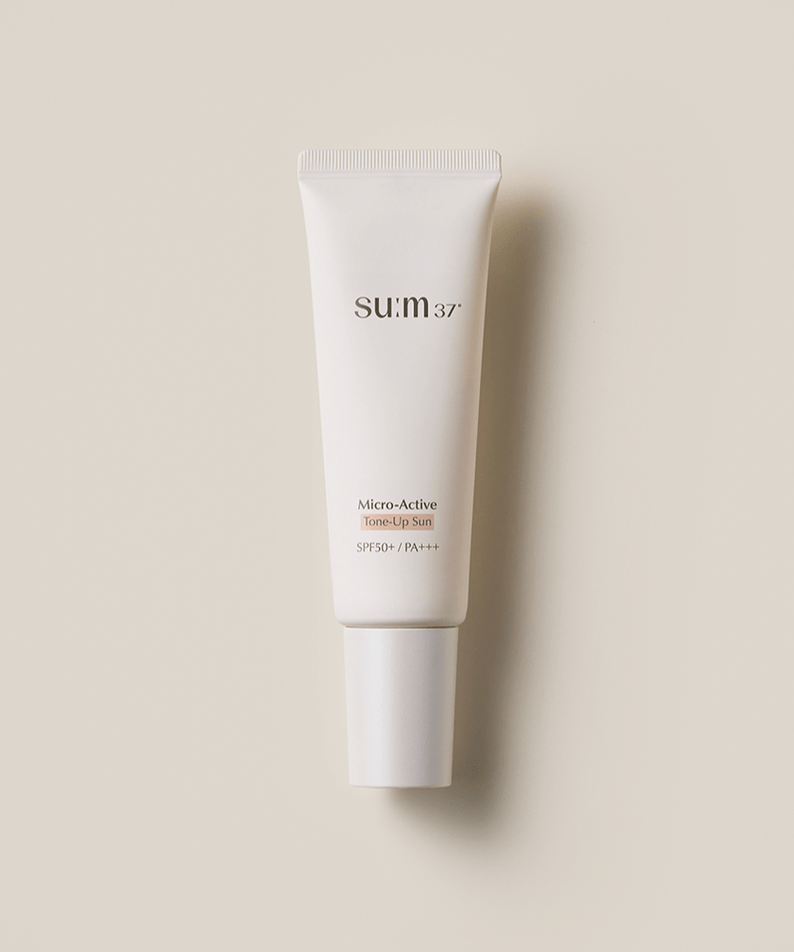 SU:M37 Microactive Tone Up Sun 50 SPF50+ / PA+++ sunscreen tube on beige background