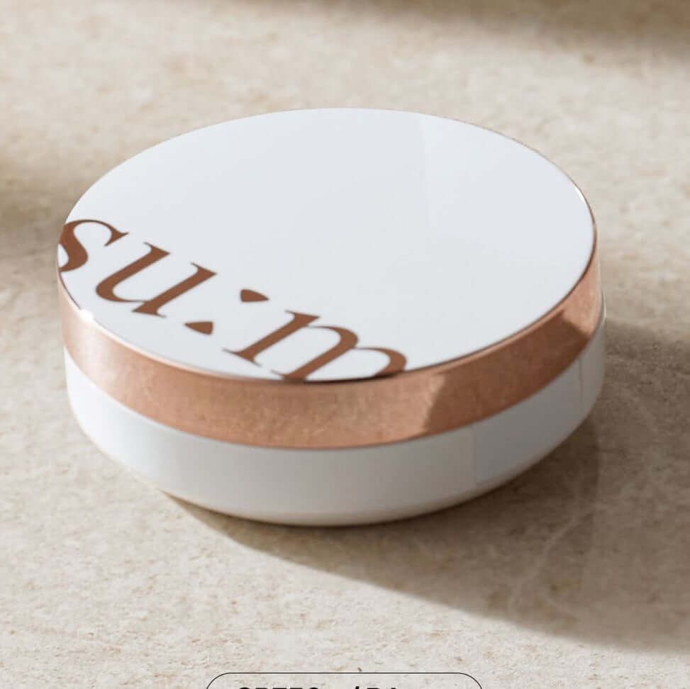 SU:M37 Sun-Away Cooling Sun CC EX product packaging on a marble surface