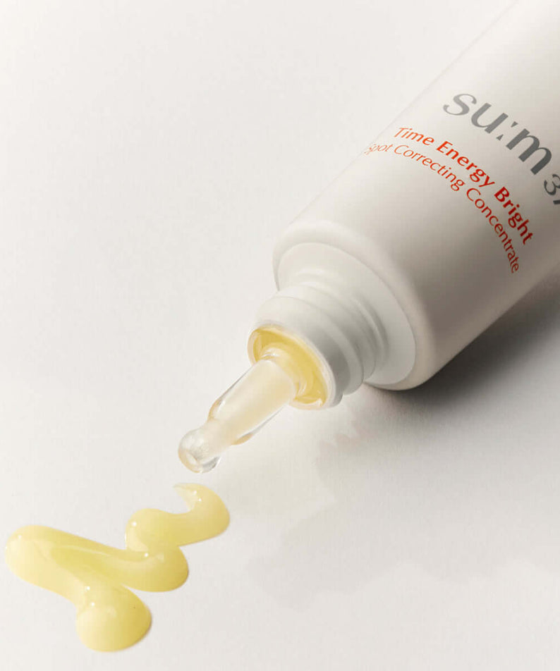 SU:M37 Time Energy Bright Spot Correcting Concentrate 35ml bottle spilling on white surface