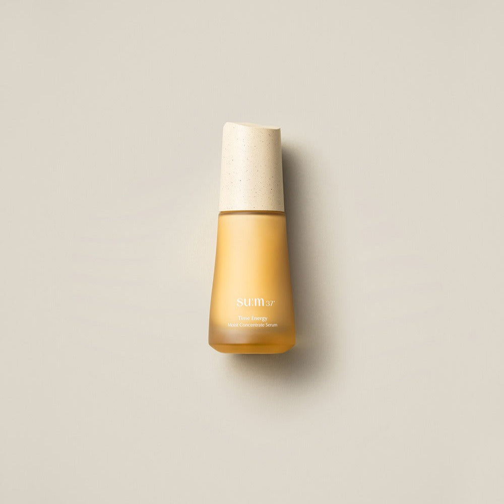 SU:M37 Time Energy Moist Concentrate Serum 50ml bottle on a beige background