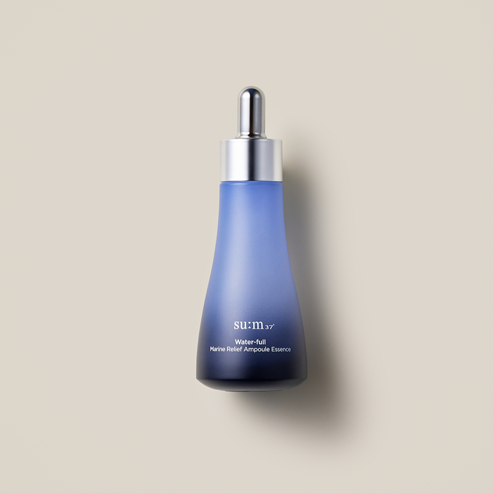 SU:M37 Water-full Marine Relief Ampoule Essence 50ml in blue bottle on neutral background