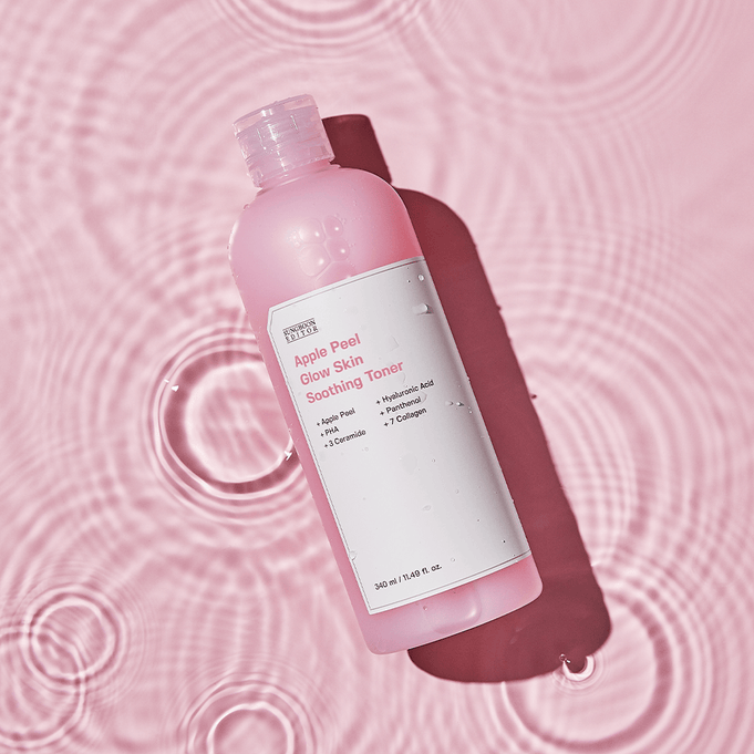 SUNGBOON EDITOR Apple Peel Glow Skin Soothing Toner 340ml in pink bottle placed on rippled water background.