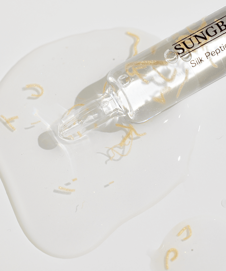 SUNGBOON EDITOR SIlk Peptide Ampoule 30ml serum texture with visible golden silk peptides, skincare product promotional image