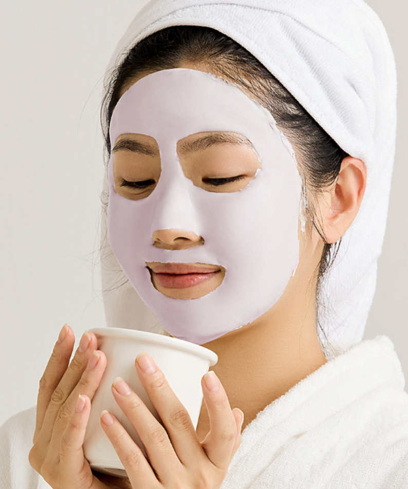 Woman enjoying relaxation with SUNGBOON EDITOR Boosting Modeling Pack Meoru Podo Brightening on face