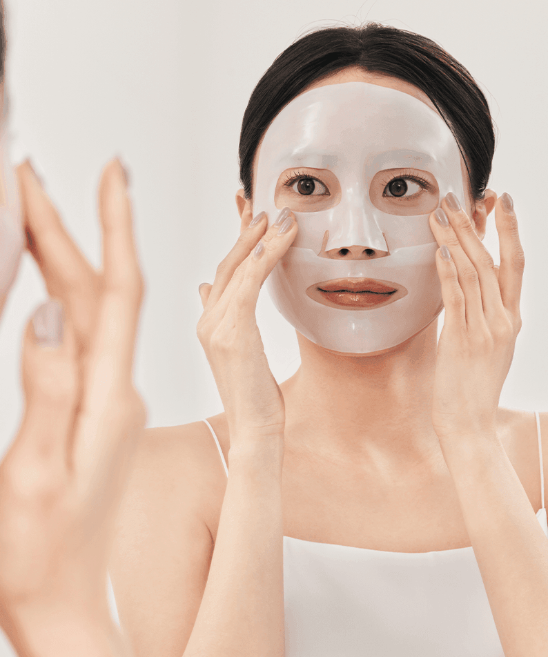 Woman applying SUNGBOON EDITOR Deep Collagen Anti Wrinkle Lifting Mask 37g for skin care.