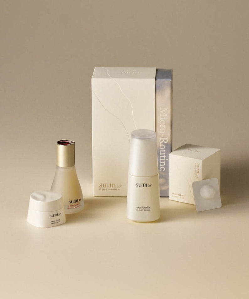 SU:M37 Micro routine set featuring skincare products on beige background
