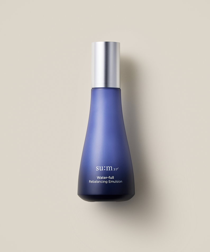 SU:M37 Water-full rebalancing emulsion 120ml in a sleek blue bottle with a silver cap on a neutral background
