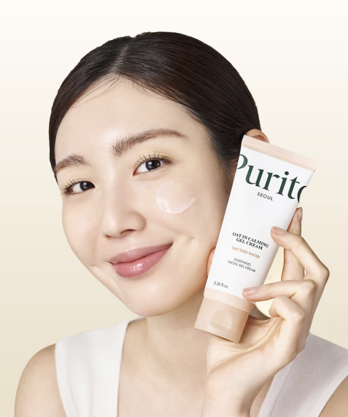 Woman holding PURITO Oat In Calming Gel Cream 100ml