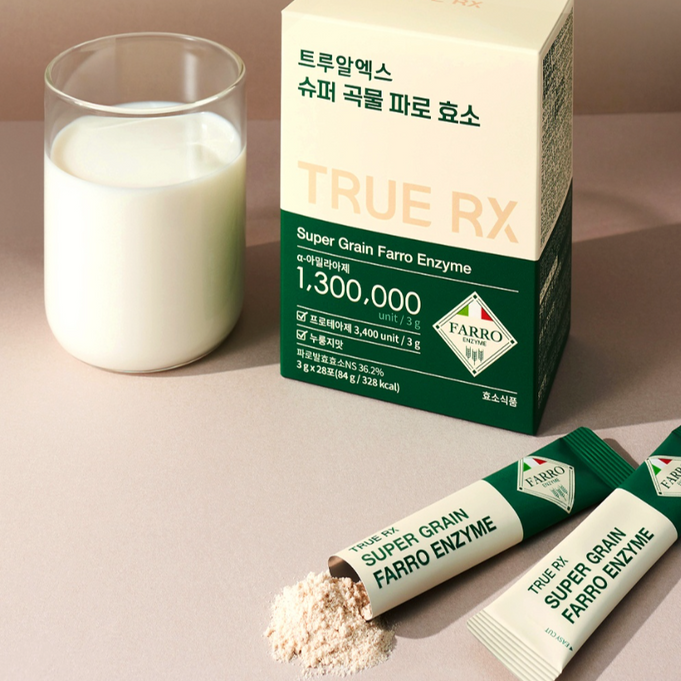 TRUE RX Super Grain Farro Enzyme 28 Packets beside a glass of milk, showing packaging and powder details for nutritional supplementation.