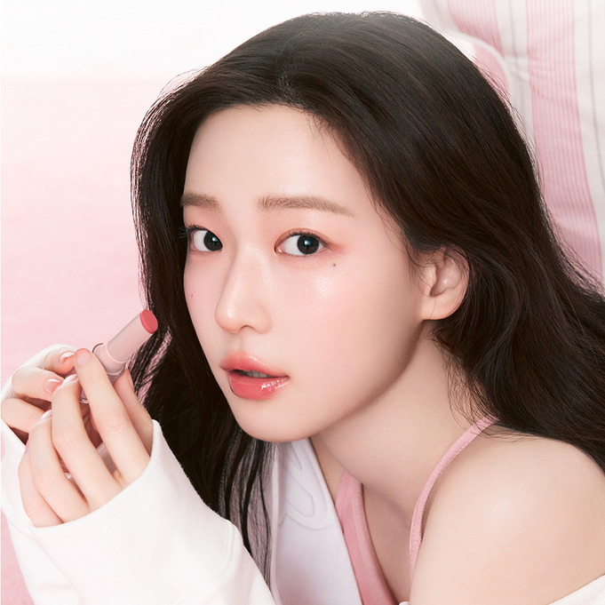 Woman holding a lipstick from HOLIKA HOLIKA Glow Rise Balm 8 colors range