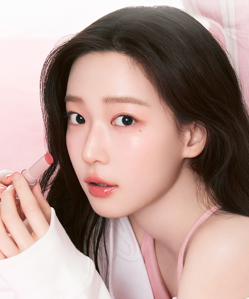 Woman holding a lipstick from HOLIKA HOLIKA Glow Rise Balm 8 colors range