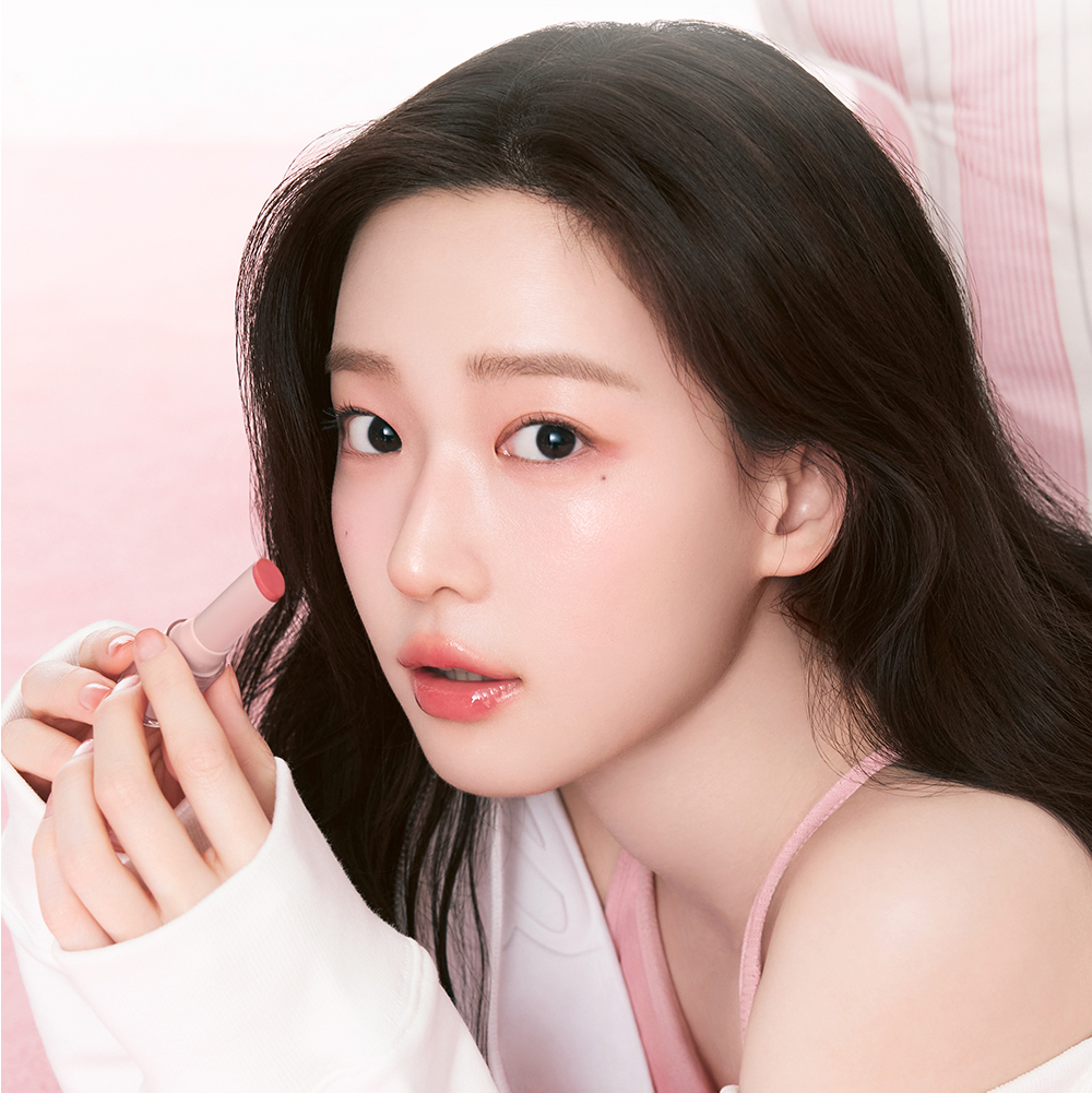 Woman holding a lipstick from HOLIKA HOLIKA Glow Rise Balm 8 colors range