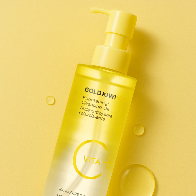 HOLIKA HOLIKA Gold Kiwi Vita C+ Brightening Cleansing Oil 200ml bottle on yellow background.