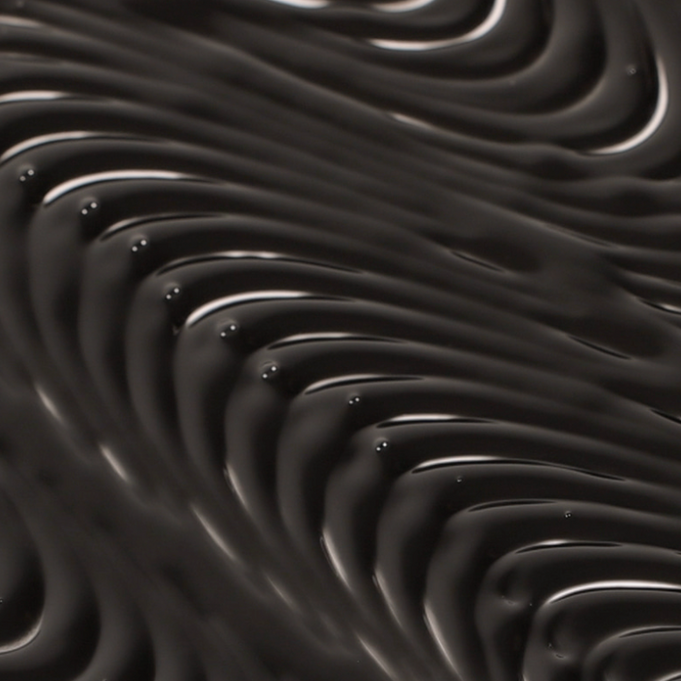 Close-up texture of TOUCH IN SOL Vegan Again Black Eyelash Serum 5.5g showcasing rich black serum.