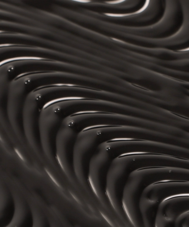 Close-up texture of TOUCH IN SOL Vegan Again Black Eyelash Serum 5.5g showcasing rich black serum.