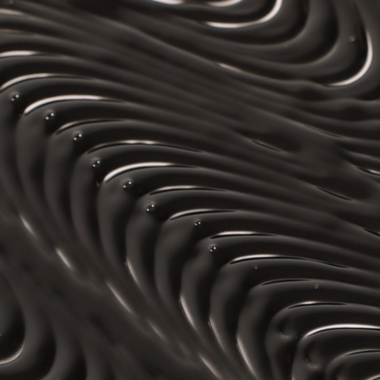 Close-up texture of TOUCH IN SOL Vegan Again Black Eyelash Serum 5.5g showcasing rich black serum.