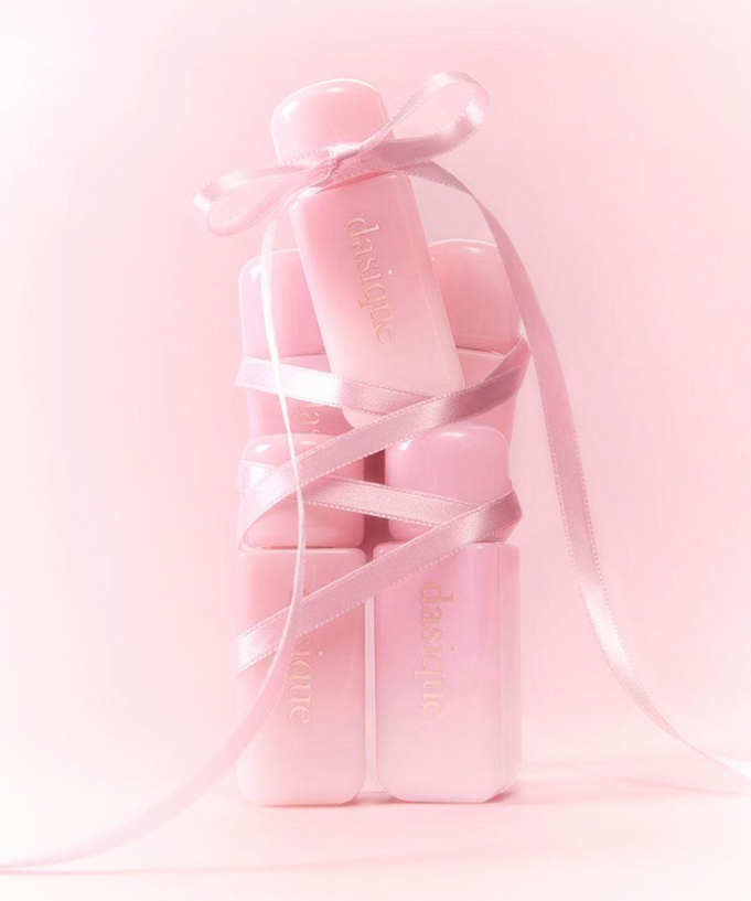 DASIQUE Silky Veil Blush in pink packaging with ribbon, showcasing luxurious cosmetic design.