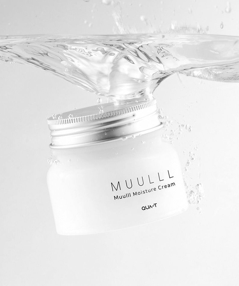 Jar of QUA-T Subuji Moisture Cream 100ml submerged in clear water, showcasing its moisture-enhancing properties.