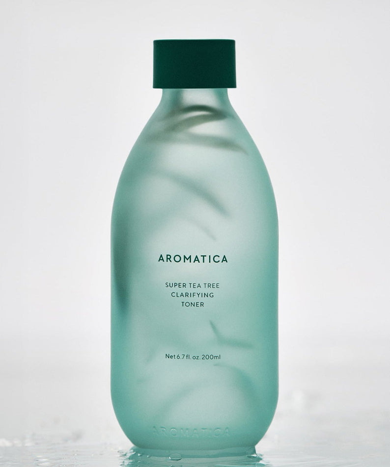 AROMATICA Super Tea Tree Clarifying Toner 200ML in a frosted green bottle on a light background.