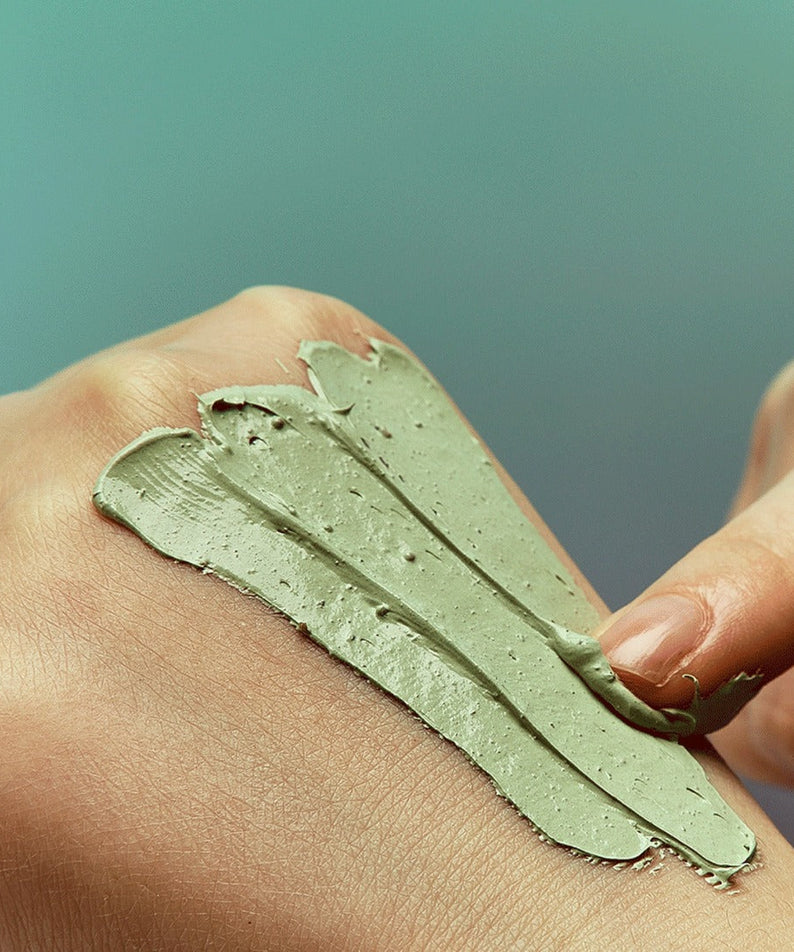 Applying INNISFREE Super Volcanic Pore Clay Mask #Cool Mint Chocolate 100ml on skin for pore cleansing and smoothness.